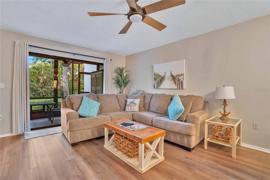 1646 Stickney Point Road, Unit 1646101 Sarasota, FL 34231 - Photo 4 of 67 a living room with furniture and a large window