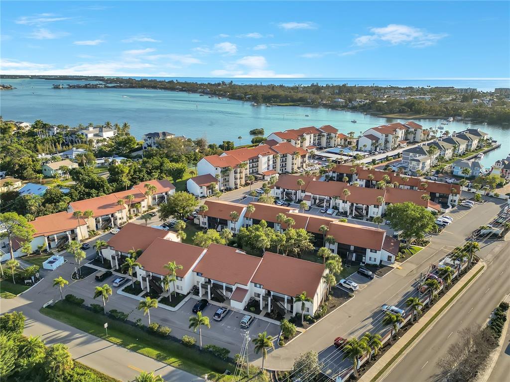 1646 Stickney Point Road, Unit 1646101 Sarasota, FL 34231 - Photo 46 of 67 an aerial view of a city with houses