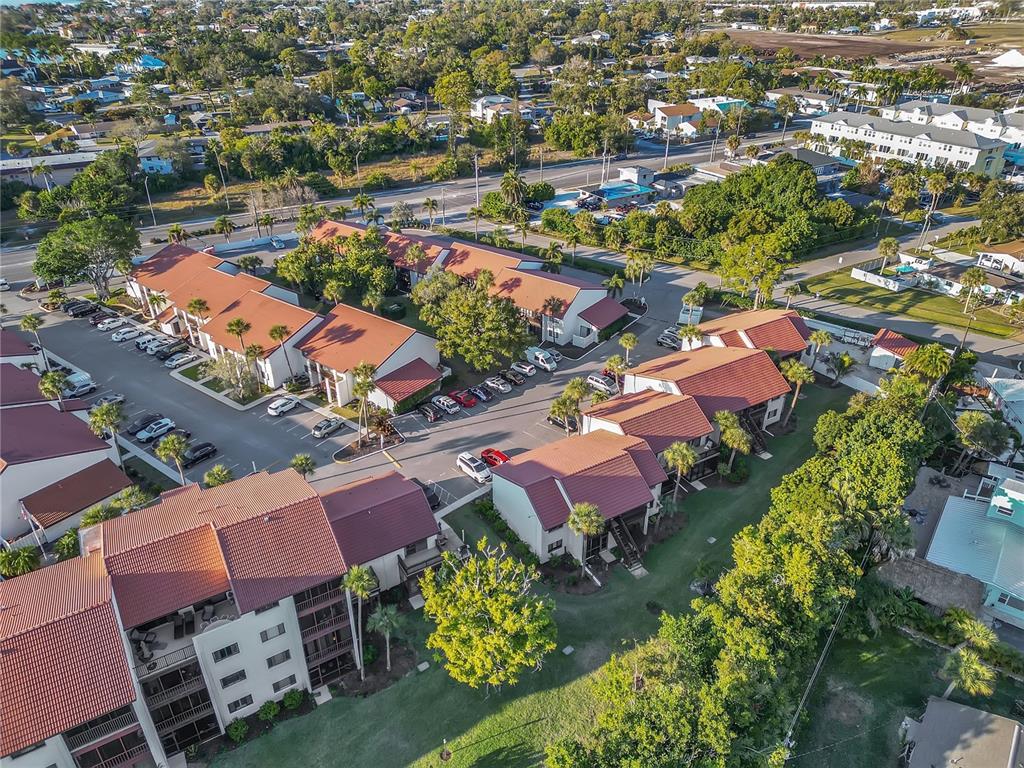 1646 Stickney Point Road, Unit 1646101 Sarasota, FL 34231 - Photo 48 of 67 an aerial view of residential houses with outdoor space