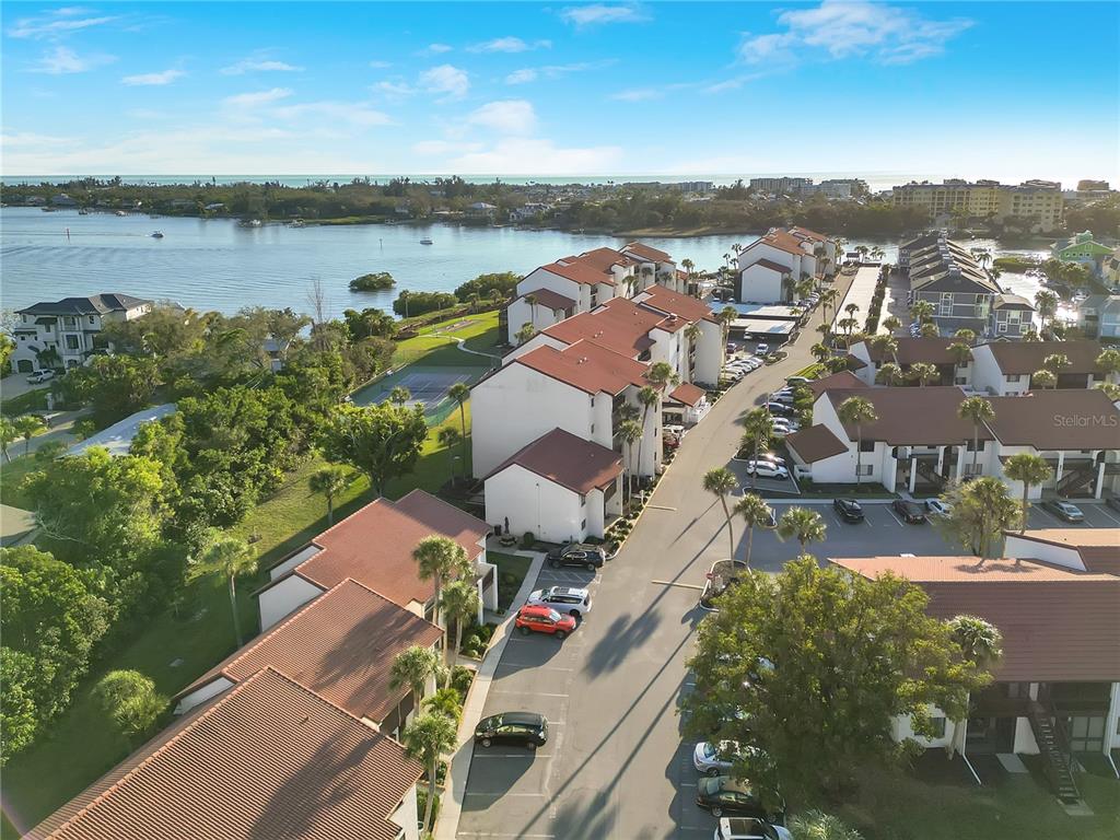 1646 Stickney Point Road, Unit 1646101 Sarasota, FL 34231 - Photo 54 of 67 an aerial view of residential houses with outdoor space and river