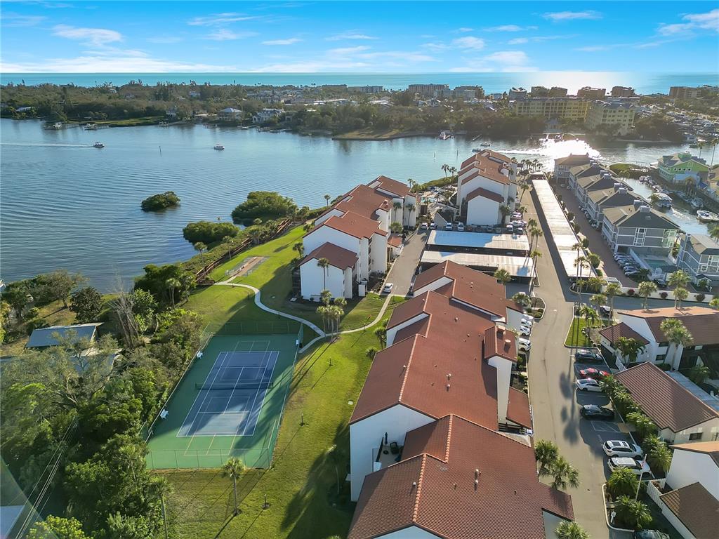 1646 Stickney Point Road, Unit 1646101 Sarasota, FL 34231 - Photo 55 of 67 an aerial view of residential houses with outdoor space and lake view