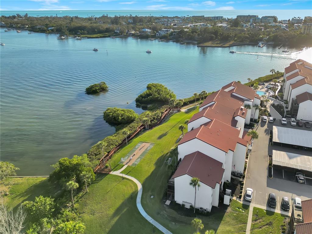 1646 Stickney Point Road, Unit 1646101 Sarasota, FL 34231 - Photo 56 of 67 an aerial view of a house with a lake view