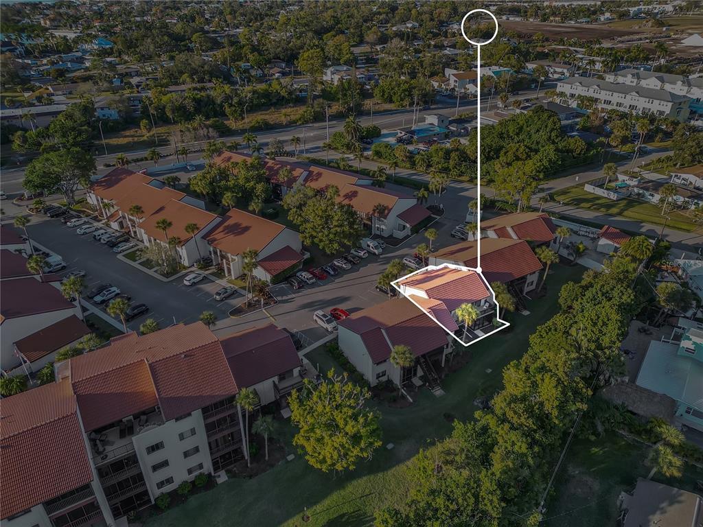 1646 Stickney Point Road, Unit 1646101 Sarasota, FL 34231 - Photo 64 of 67 an aerial view of a house with a garden