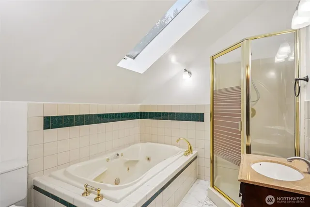 a bathroom with a tub and a shower