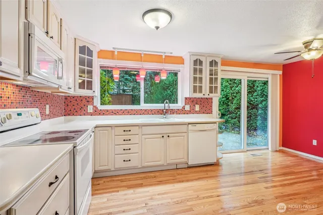 a kitchen that has a sink and a stove