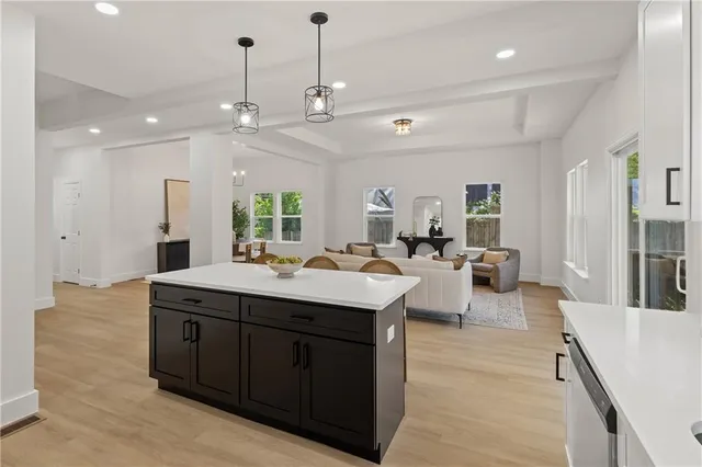 a large bathroom with a large tub and sink