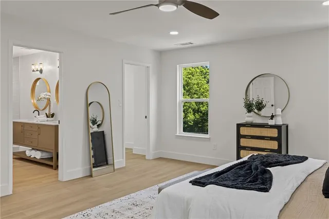 a bedroom with a bed and a dresser