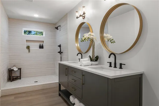 a bathroom with a double vanity sink and a mirror