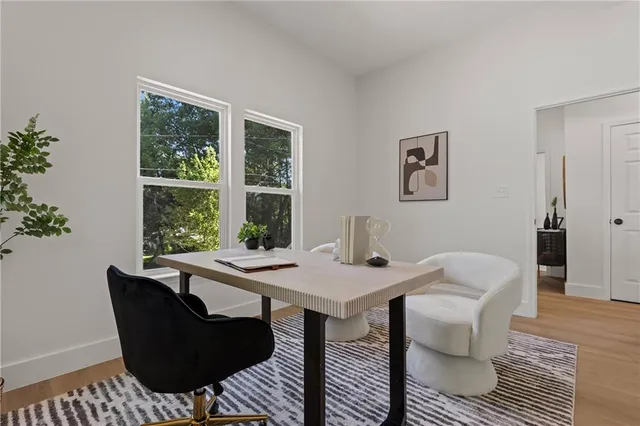 a view of a dining room with furniture window and outside view