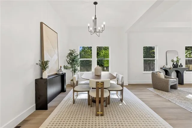 a view of a dining room with furniture window and outside view