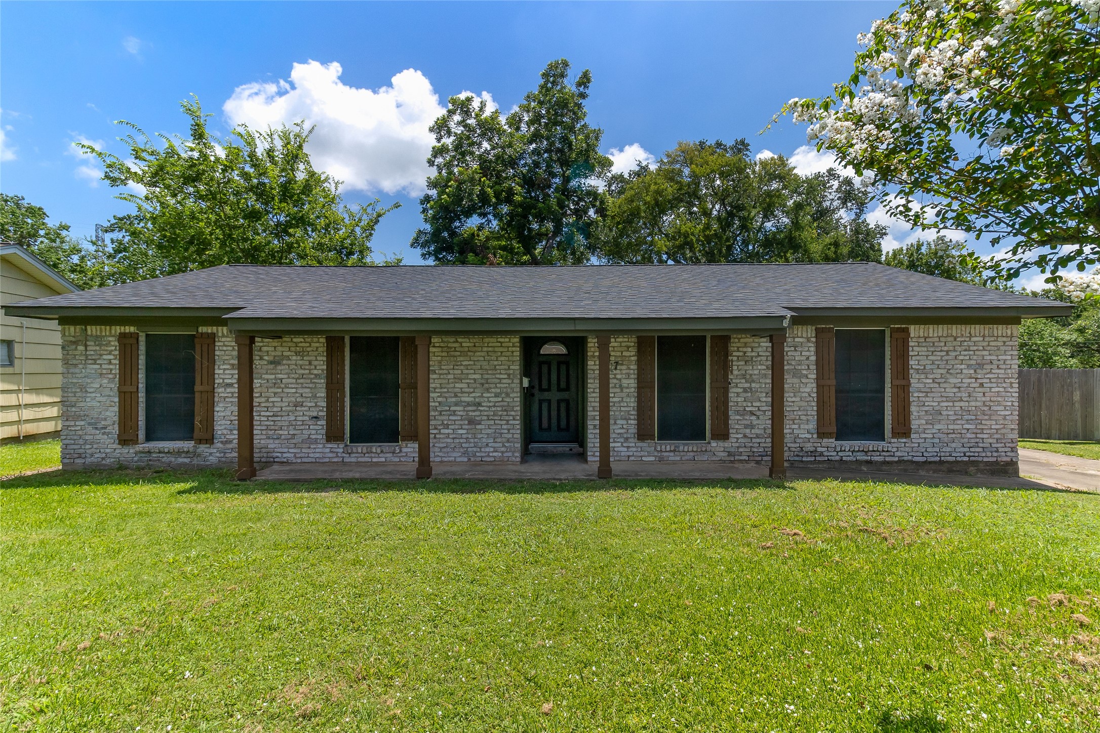 117 Cannon Street Clute, TX 77531 - Photo 19 of 24 Classic brick exterior is complemented by updated exterior paint from recent years, giving the home a clean, well-kept look without losing its original charm.