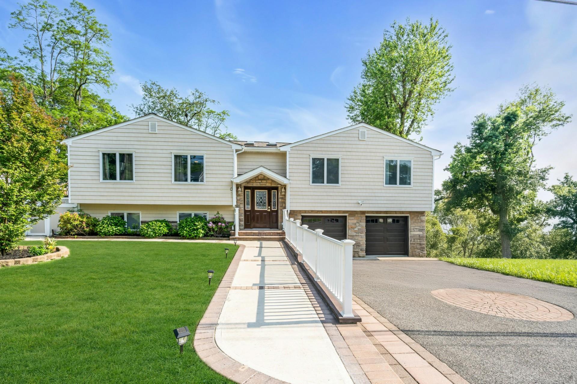 a front view of a house with a yard