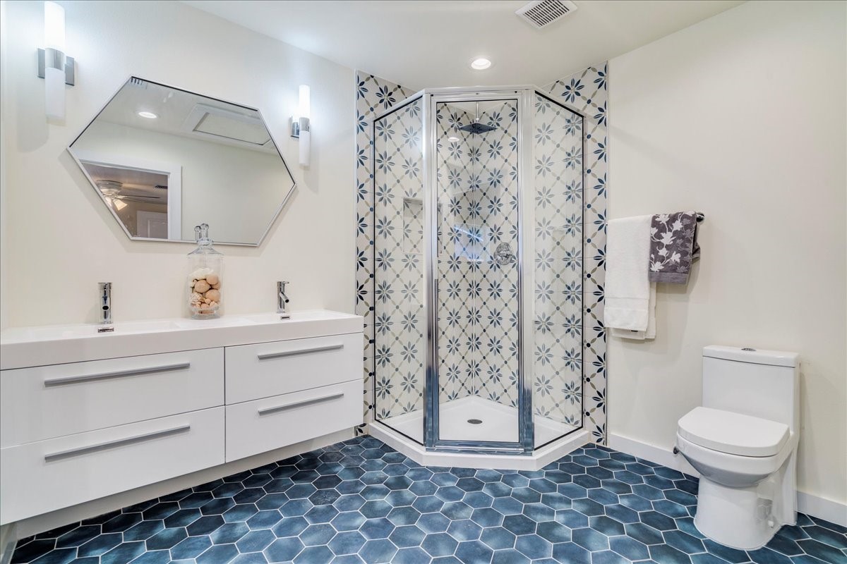 1120 Spur Street Austin, TX 78721 - Photo 13 of 31 a bathroom with a toilet sink and shower