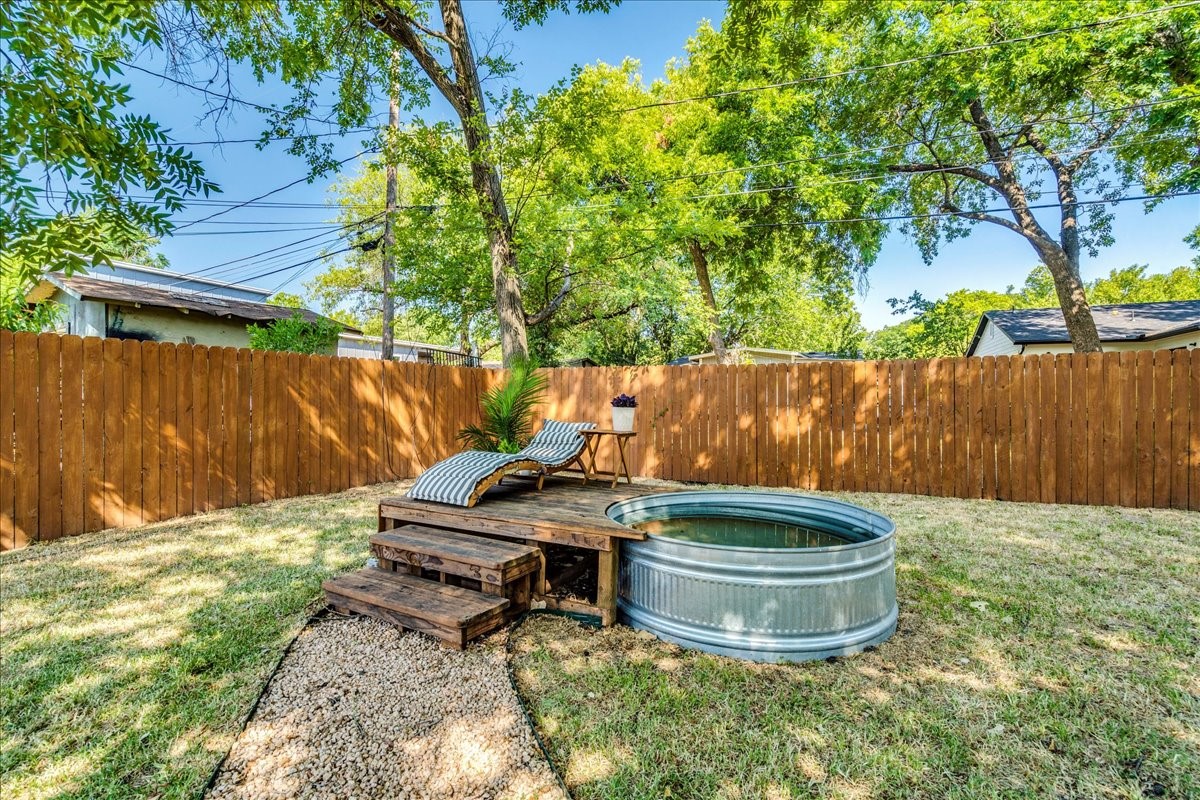 1120 Spur Street Austin, TX 78721 - Photo 24 of 31 a small pool with some trees in the background