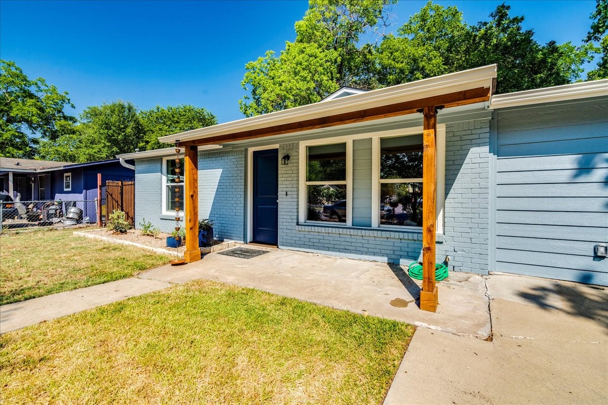 1120 Spur Street Austin, TX 78721 - Photo 30 of 31 a house view with a swimming pool
