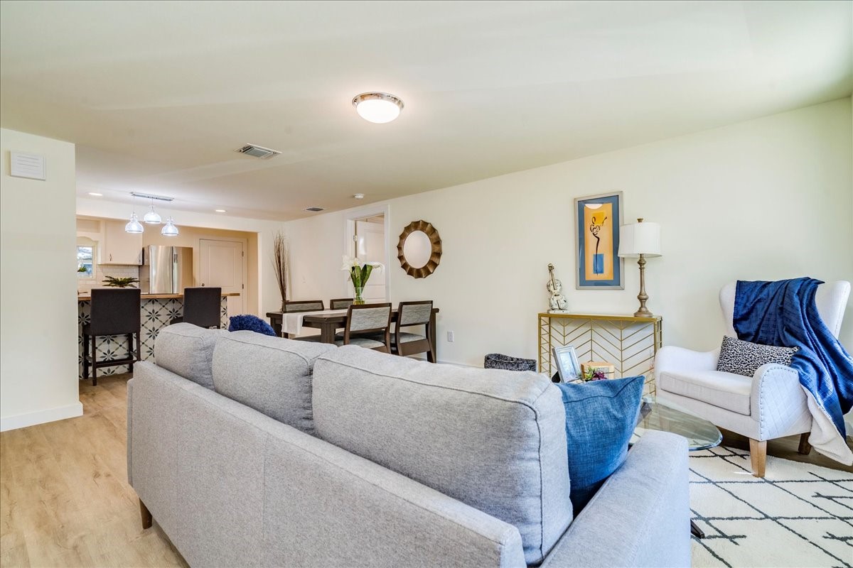 1120 Spur Street Austin, TX 78721 - Photo 5 of 31 a living room with furniture and a wooden floor
