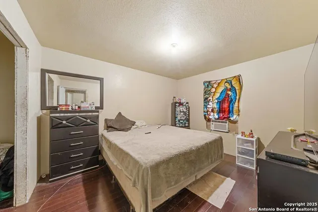 a bedroom with a bed and furniture