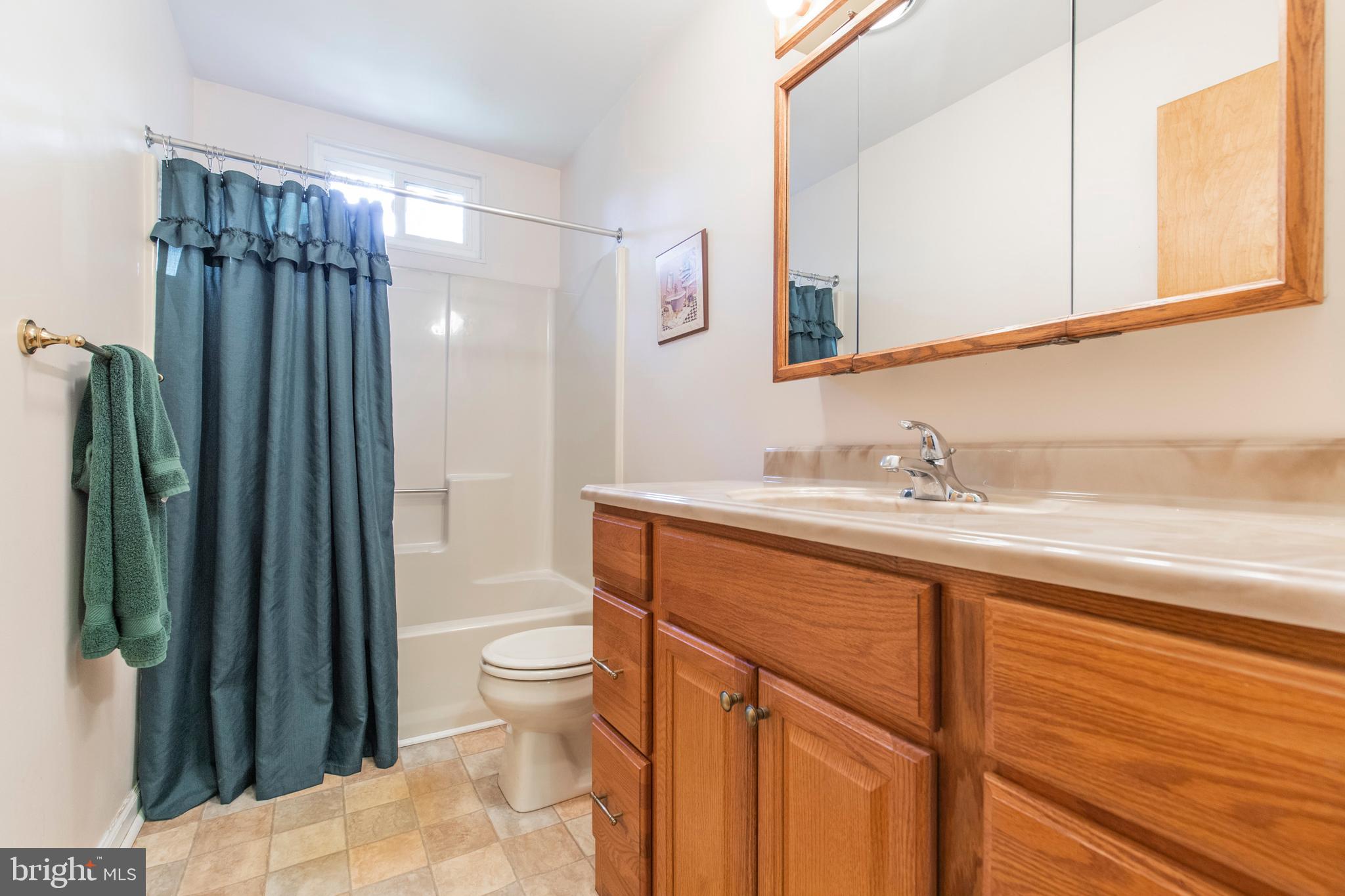 5 Edison Avenue Clementon, NJ 08021 - Photo 16 of 28 a bathroom with a sink a toilet and shower