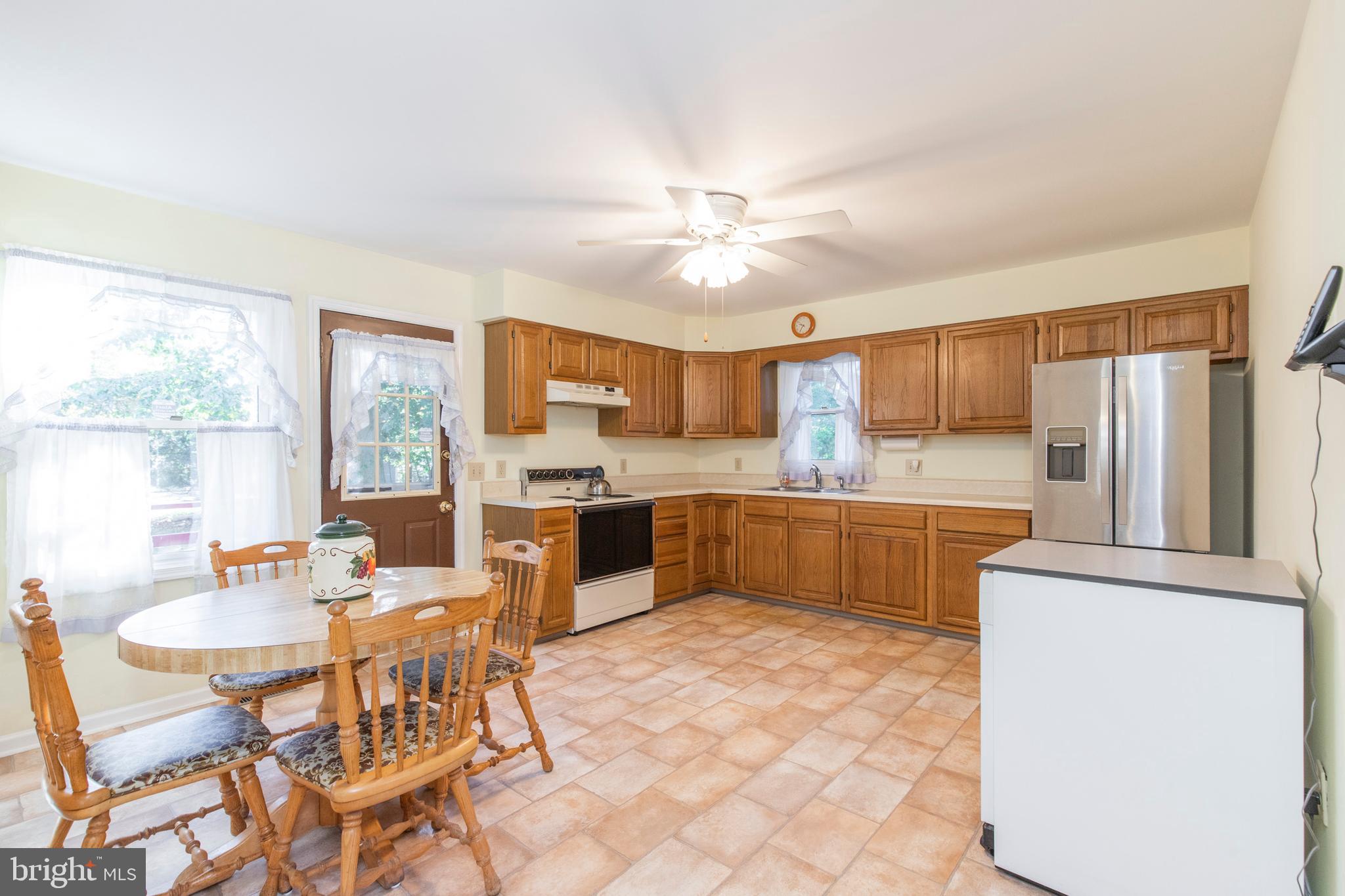 5 Edison Avenue Clementon, NJ 08021 - Photo 7 of 28 a kitchen with stainless steel appliances kitchen island granite countertop a sink and cabinets