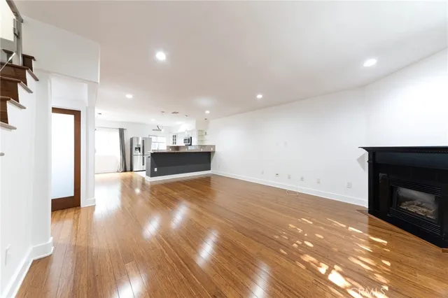 a view of a kitchen with a sink and a fireplace