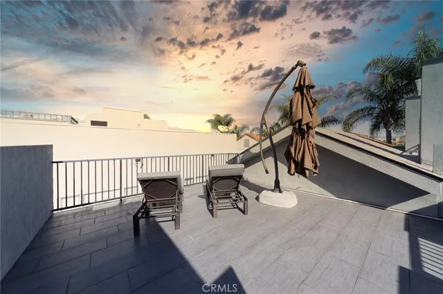 a view of a chairs and table on the terrace