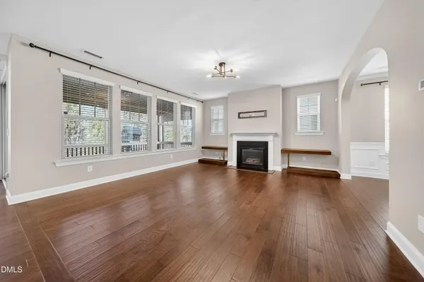 a living room with furniture fireplace and flat screen tv