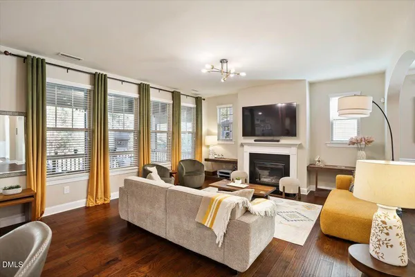 a view of a hallway with entryway wooden floor and front door