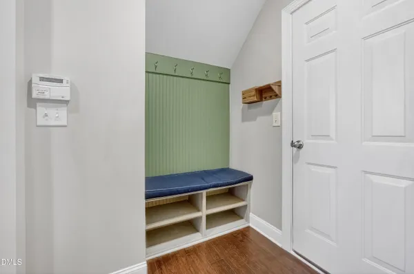 an empty room with windows and entrance