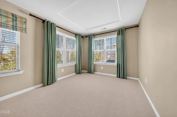 a bathroom with a granite countertop sink a mirror and a shower