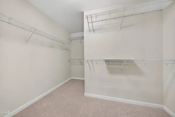 a large bathroom with a tub sink shower and mirror