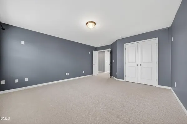 a view of room with window and ceiling fan