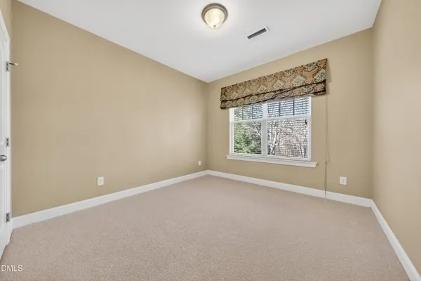 a white toilet sitting next to a bath tub