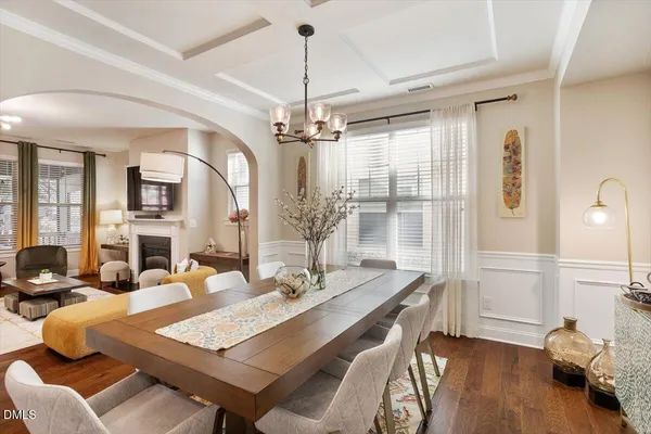 a workspace with furniture and a chandelier