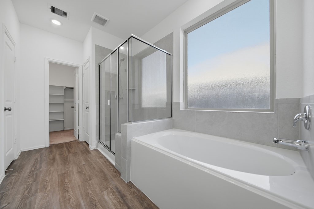 14230 Overbrook Willow Way Rosharon, TX 77583 - Photo 22 of 50 a bathroom with a bathtub and a shower