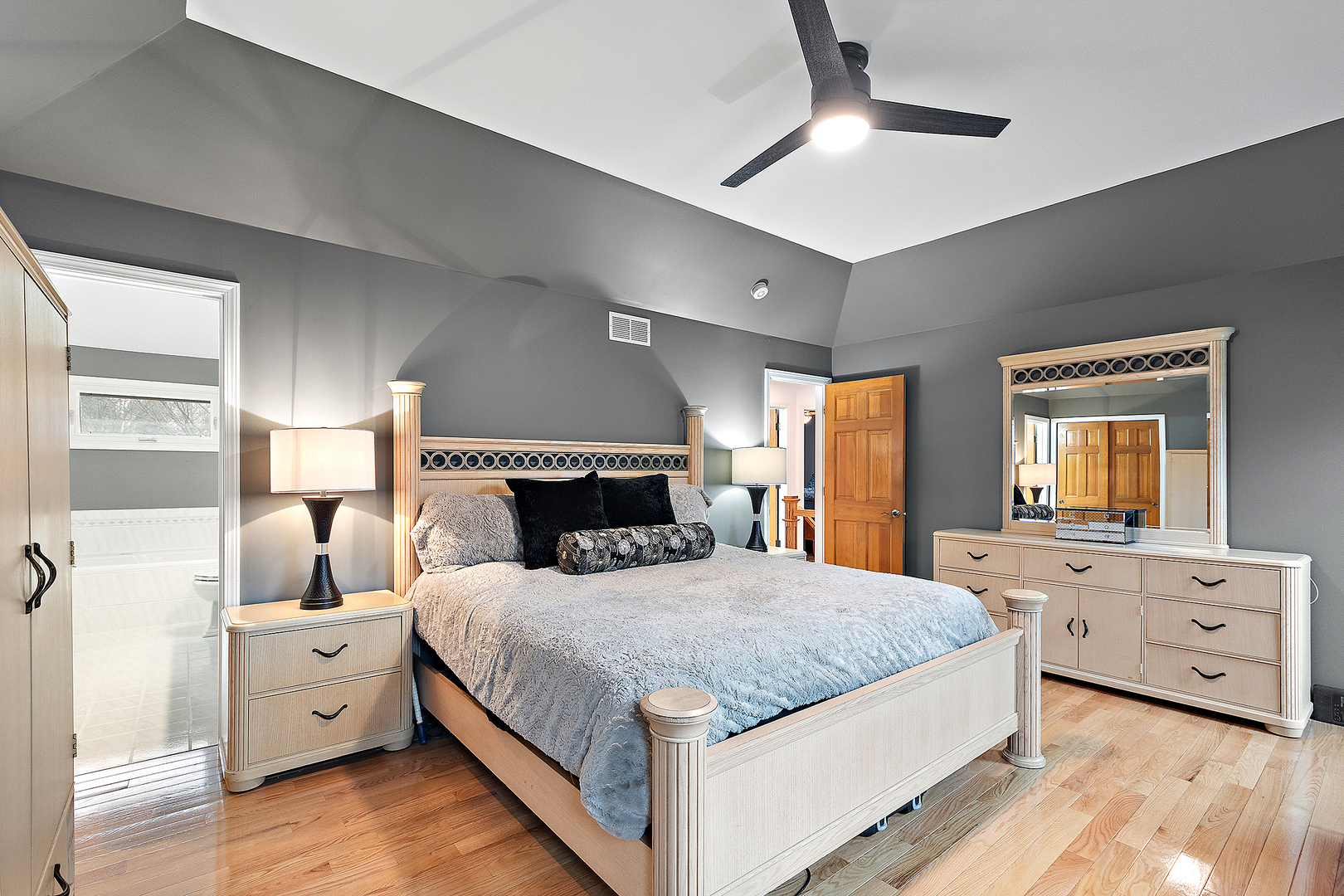 806 Wescott Road Bolingbrook, IL 60440 - Photo 13 of 28 a bedroom with a large bed and a tv on the dresser