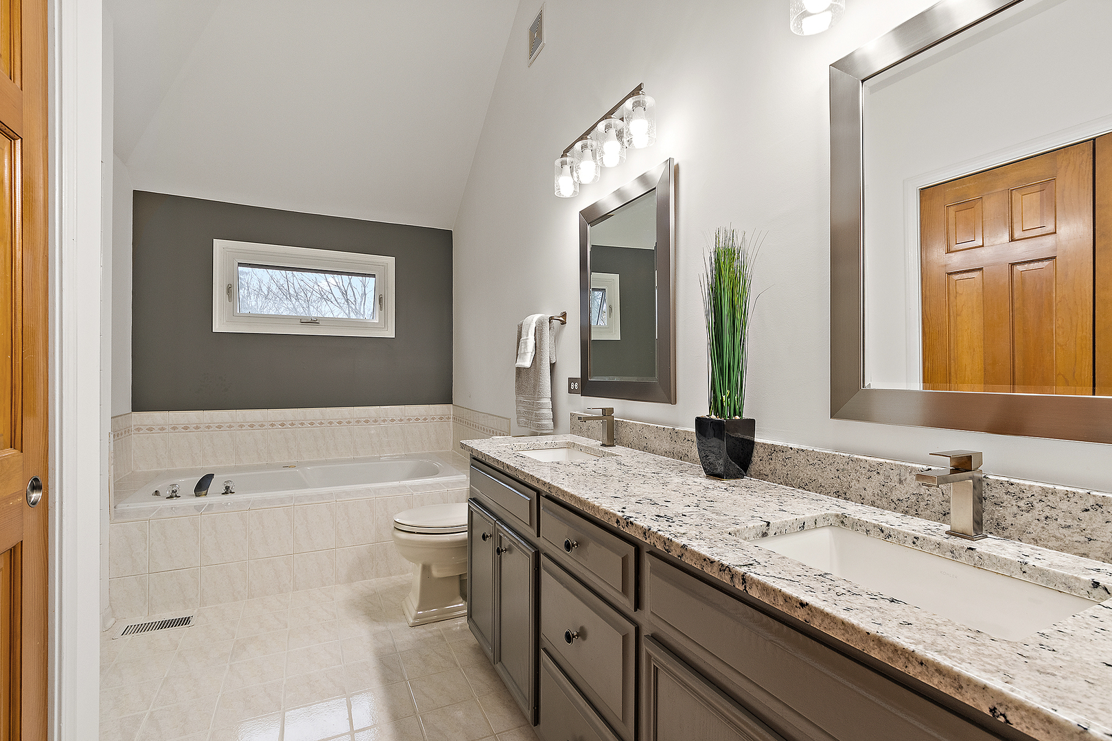 806 Wescott Road Bolingbrook, IL 60440 - Photo 14 of 28 a bathroom with a granite countertop sink mirror vanity and toilet