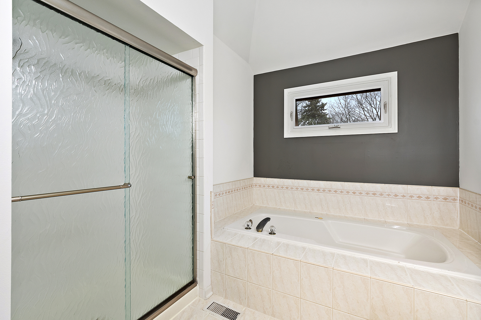 806 Wescott Road Bolingbrook, IL 60440 - Photo 15 of 28 a bathroom with a bathtub and a shower