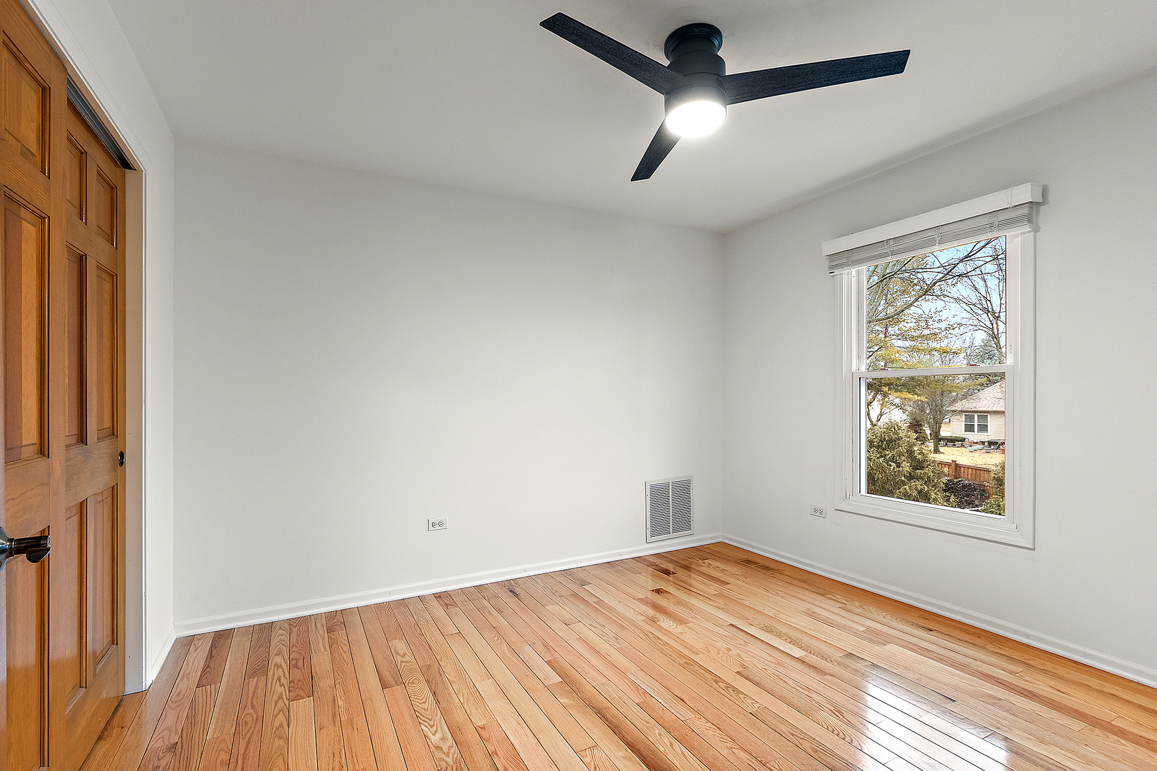 806 Wescott Road Bolingbrook, IL 60440 - Photo 18 of 28 a view of empty room with wooden floor and fan