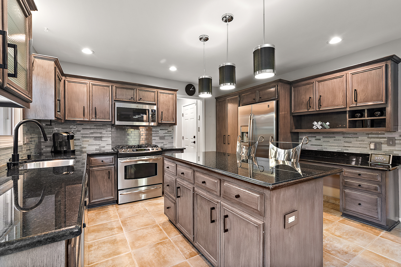 806 Wescott Road Bolingbrook, IL 60440 - Photo 2 of 28 a kitchen with stainless steel appliances granite countertop a sink a stove a refrigerator cabinets and a kitchen island