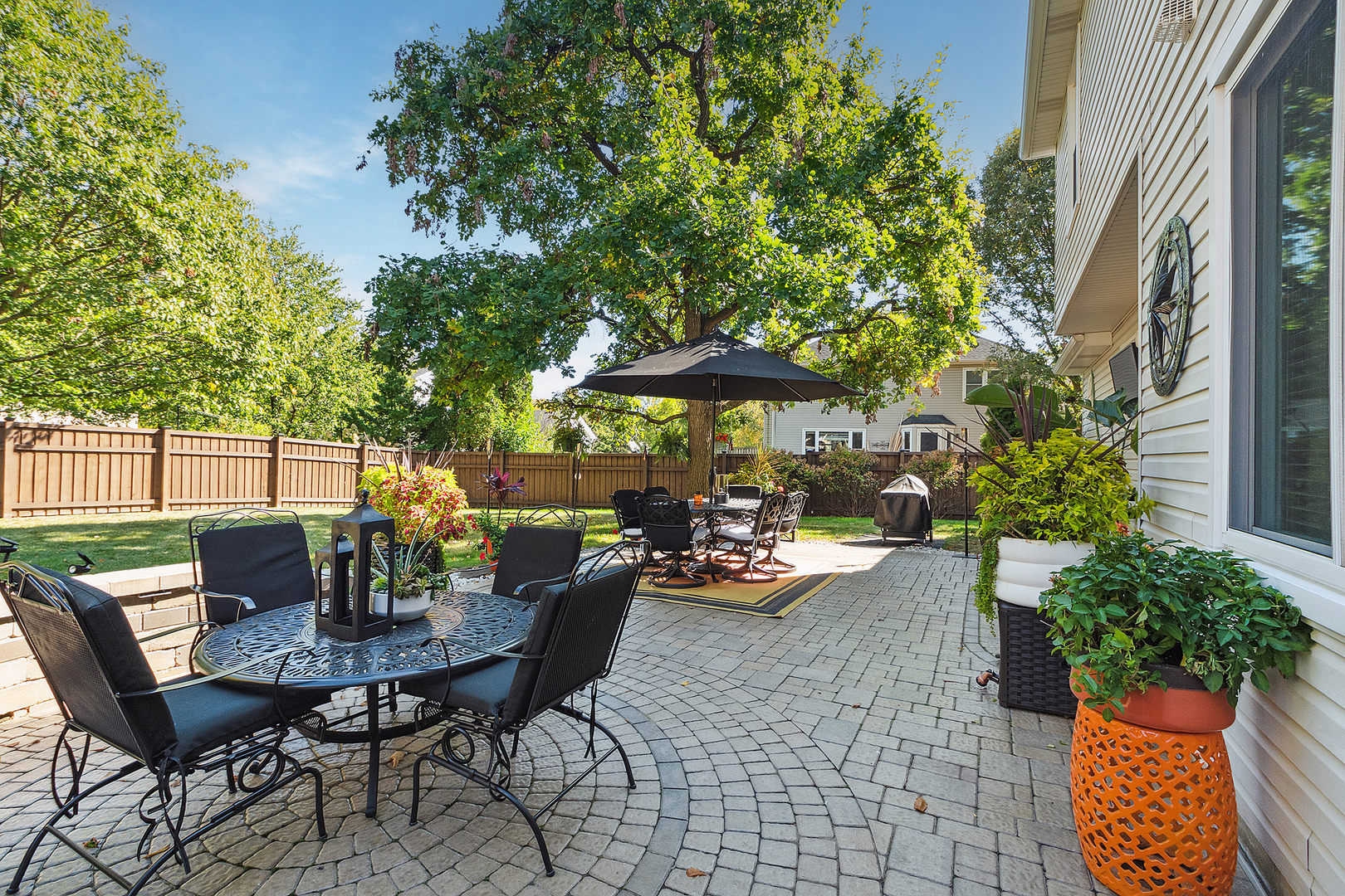 806 Wescott Road Bolingbrook, IL 60440 - Photo 25 of 28 a view of a patio with table and chairs and potted plants