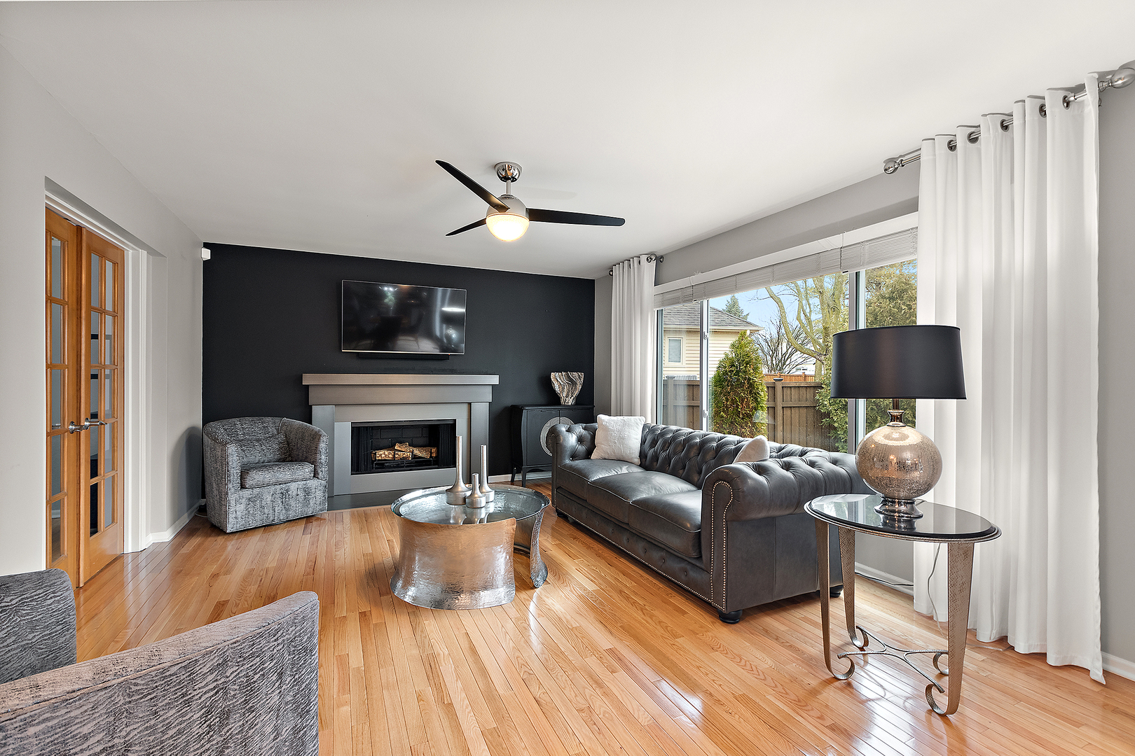 806 Wescott Road Bolingbrook, IL 60440 - Photo 7 of 28 a living room with furniture a large window and a fireplace