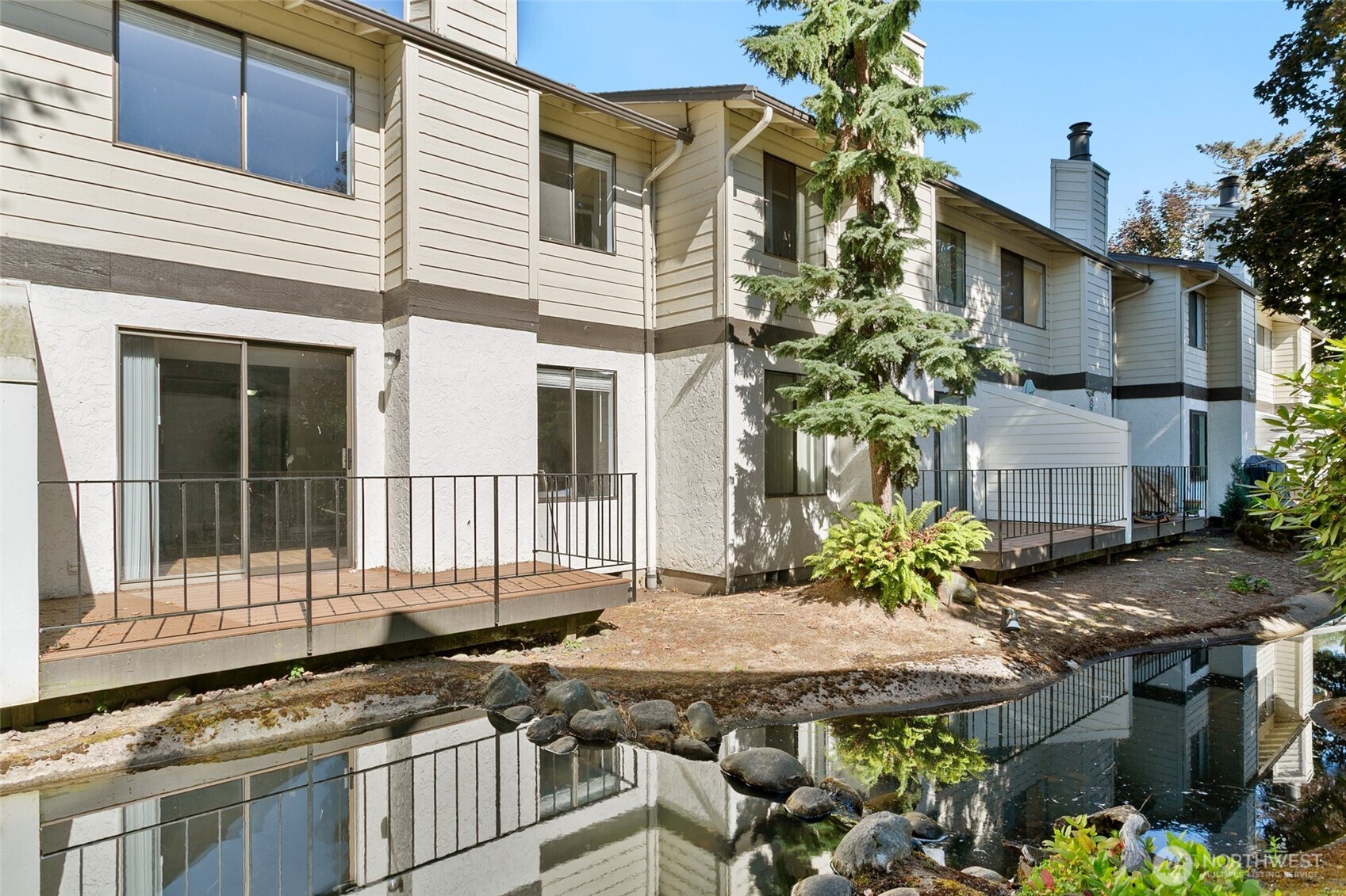1802 Maple Lane, Unit A5 Kent, WA 98030 - Photo 22 of 27 a backyard of a house with table and chairs