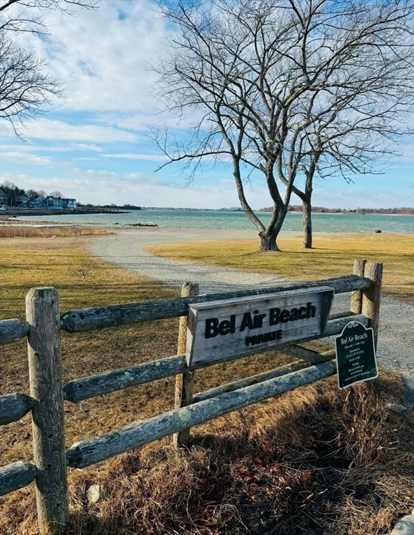 53 Bel Air Road Hingham, MA 02043 - Photo 9 of 10 a view of a swimming pool with a table and chairs under an umbrella