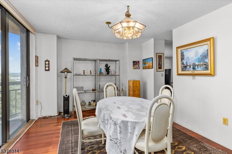 401 Harmon Cove Tower Secaucus, NJ 07094 - Photo 12 of 47 a view of a dining room with furniture