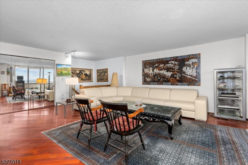 401 Harmon Cove Tower Secaucus, NJ 07094 - Photo 17 of 47 a view of a livingroom and dining room