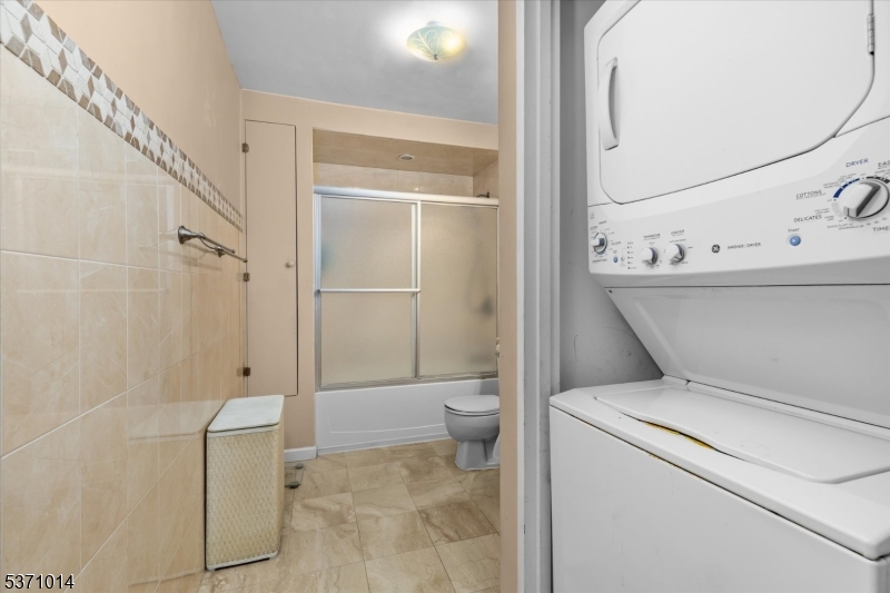 401 Harmon Cove Tower Secaucus, NJ 07094 - Photo 29 of 47 a bathroom with a toilet and a shower