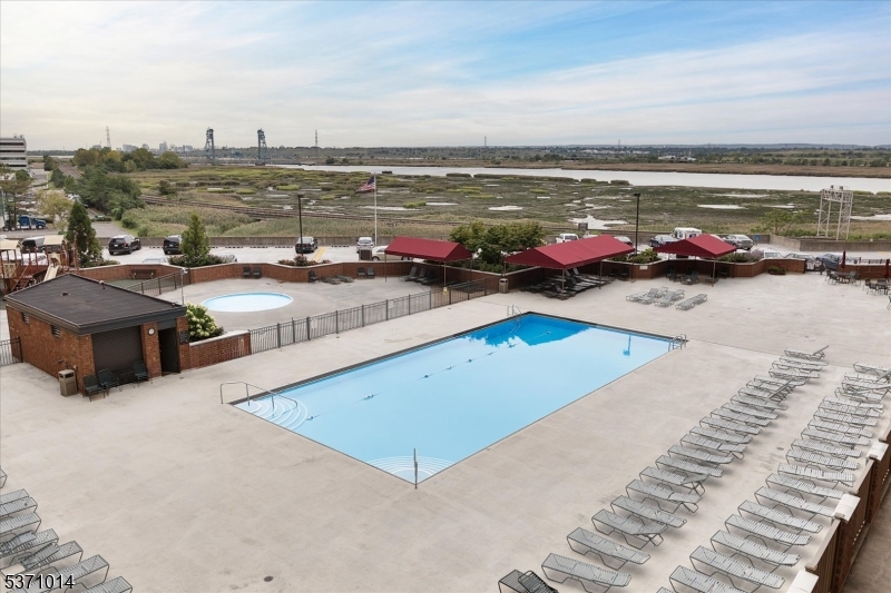 401 Harmon Cove Tower Secaucus, NJ 07094 - Photo 30 of 47 a view of a swimming pool with an ocean view