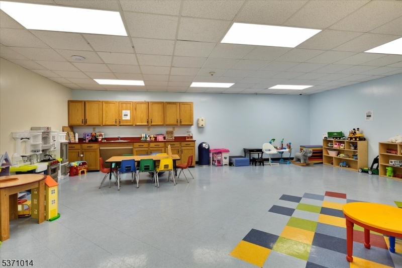 401 Harmon Cove Tower Secaucus, NJ 07094 - Photo 39 of 47 a living room with furniture and a pool table