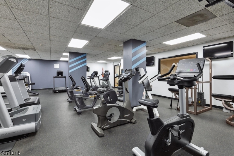 401 Harmon Cove Tower Secaucus, NJ 07094 - Photo 41 of 47 a view of a room with gym equipment