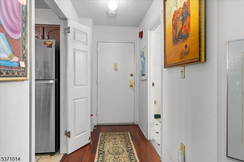 401 Harmon Cove Tower Secaucus, NJ 07094 - Photo 7 of 47 a view of bathroom with a mirror and a shower